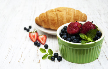 Fresh berries and croissant
