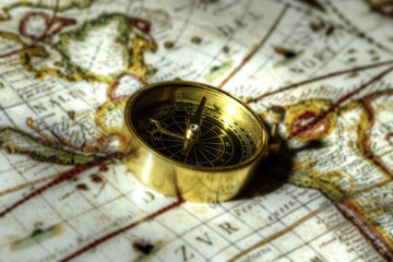 Antique compass on map.
Antique brass compass on an old map.