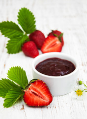 Strawberry jam and fresh strawberries