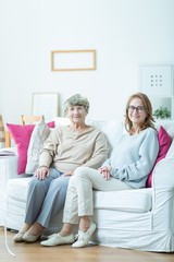 Obraz premium Elderly woman with her carer