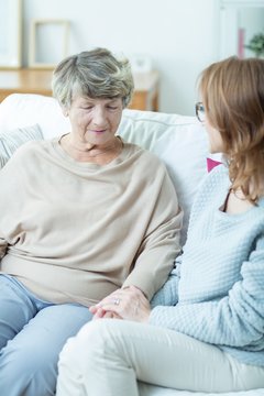 Female senior talking with caregiver