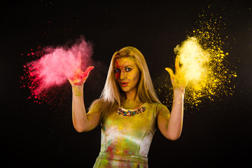 Beautiful young woman with colored powder