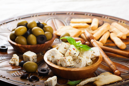 Cubes of feta cheese with olives