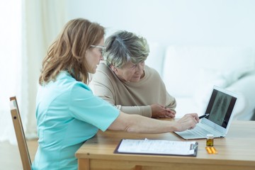 Aged woman during medical consultation