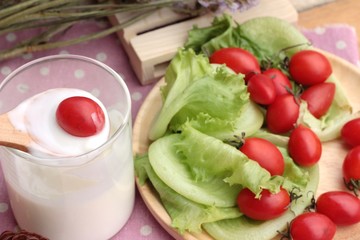 White yogurt and fresh cherry tomatoes