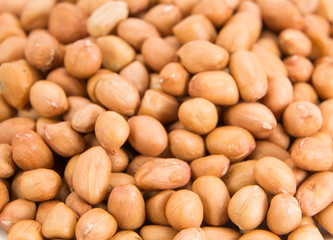 peanuts without shell on wooden background