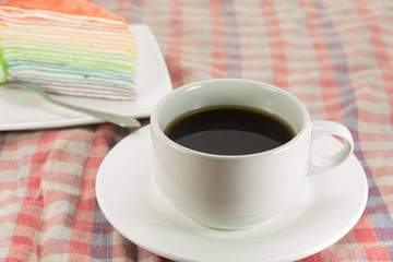 Rainbow layer cake and coffee