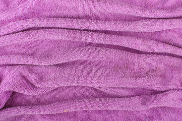 Fototapeta na wymiar Wavy purple microfiber cleaning cloth abstract surface pattern