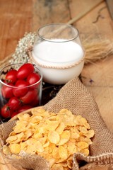 corn flake and milk with fresh cherry tomatoes.