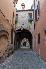 Fototapeta premium Ancient medieval street in the downtown of Ferrara city