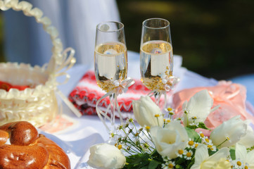 two glasses with champagne standing on the table