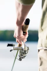 Photo sur Plexiglas Pêcher gros plan, de, pêcheur, à, canne pêche, dans main