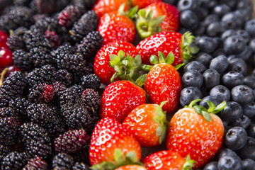 Some gooseberries, raspberries, strawberries and blueberries ove