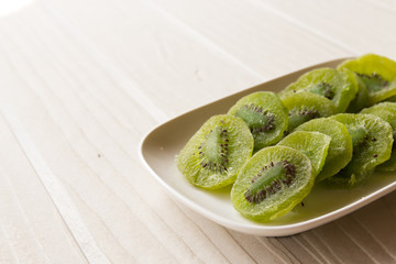 slices of dried kiwi on the sacking background