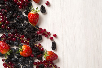 Some gooseberries, raspberries, strawberries and blueberries ove