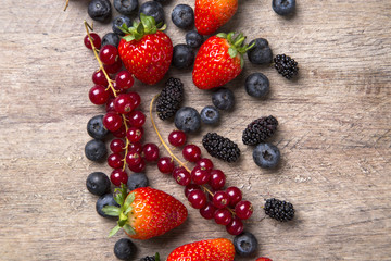 Some gooseberries, raspberries, strawberries and blueberries ove