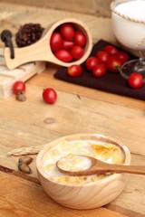 corn flake and milk with fresh cherry tomatoes.