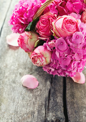 beautiful pink roses and hydrangea in basket