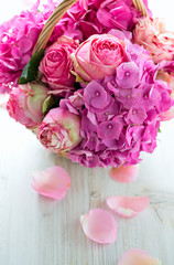 beautiful pink roses and hydrangea in basket