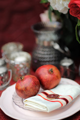 Stylish table set with natural pomegranates