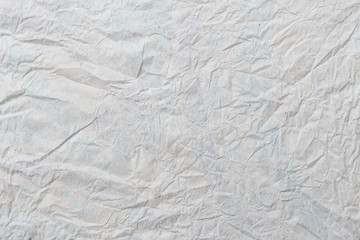 Grey crumpled paper texture and background