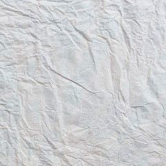 Grey crumpled paper texture and background