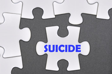 Fototapeta premium jigsaw puzzle written word Suicide