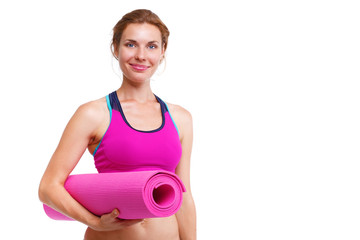 Portrait of young beautiful woman holding yoga mat - isolated.