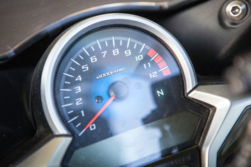 This is motorcycle dashboard closeup.