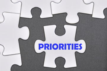 Fototapeta premium jigsaw puzzle written word priorities