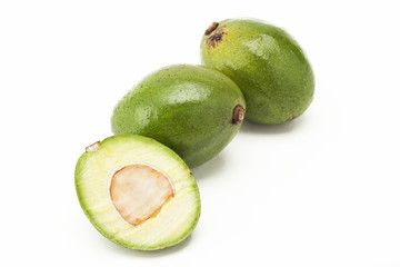 Avocados group on background