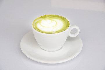 Latte green tea in white cup