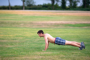 The image with a man going exercises in a park