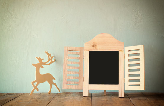 abstract filtered photo of decorative chalkboard frame and deer