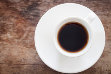 Top view of cup of fresh espresso on table