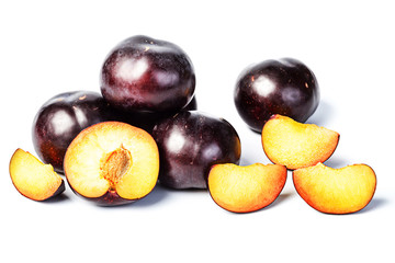 sliced plum on white, tilt shift lens