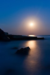Seascape at night. The coastline moonlight