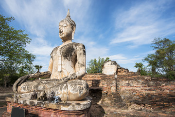 Fototapeta na wymiar Ancient Buddha statue at Sukhothai historical park, Thailand.