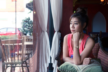 woman model action thinking in cafe coffee