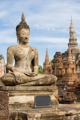 Fototapeta premium Ancient Buddha Statue at Sukhothai historical park, Mahathat Temple ,Thailand.