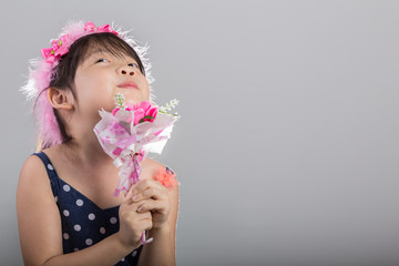 Obraz na płótnie Canvas Little Girl Holding Flowers Background / Child with Flowers Background