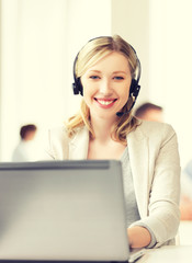 helpline operator with headphones in call centre