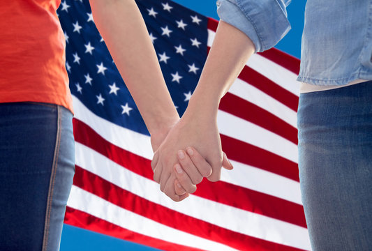 close up of lesbian couple holding hands - Powered by Adobe