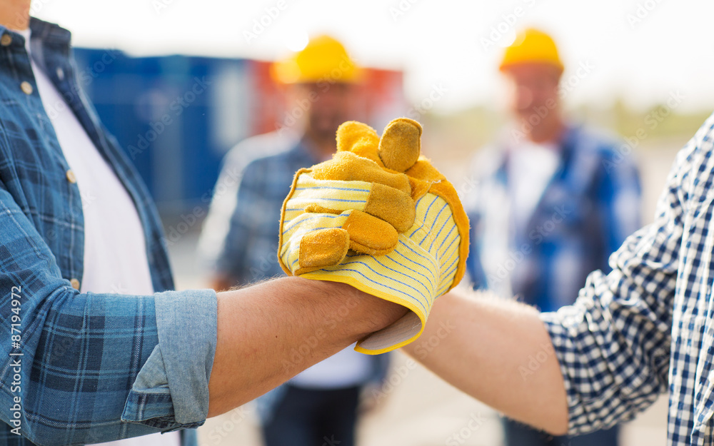 Sticker close up of builders hands making handshake