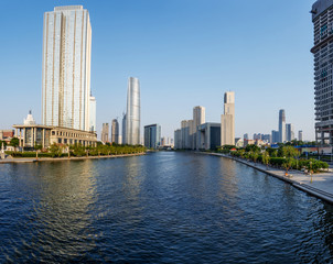 modern buildings in urban city at riverbank