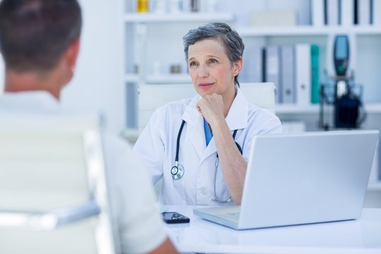 Female doctor speaking with her patient 