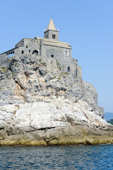 Fototapeta na wymiar Old church on a rocky coastal outcrop at Portovenere, Italy