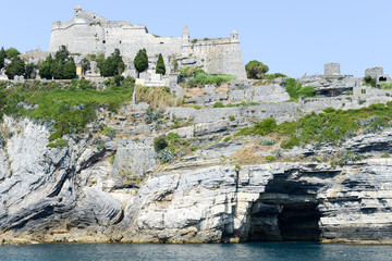 Old fortless on a rocky coastal outcrop at Portovenere, Italy