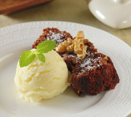 Chocolate brownie with ice cream and walnut