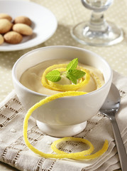 Lemon dessert with custard, cookies and mint.